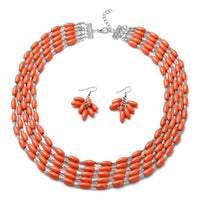 765.50 ctw Orange Howlite Earrings and Drape Necklace 20 Inches in Black Oxidized Silvertone and Stainless Steel