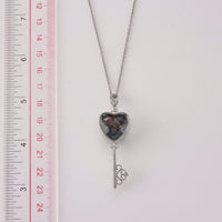 Pietersite and Simulated Diamond Pendant in Silvertone with Stainless Steel Necklace (20 inches) 36.00 ctw