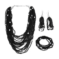 Black Seed Beaded, Simulated Pearl Multi Layered Necklace 20 Inches and Dangle Earrings and Stretch Bracelet in Stainless Steel