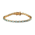 Madagascar Paraiba Apatite and Moissanite Tennis Bracelet in Vermeil Yellow Gold Over Sterling Silver (7.25 In) 7.60 Grams 7.35 ctw - Sticky add to cart bar