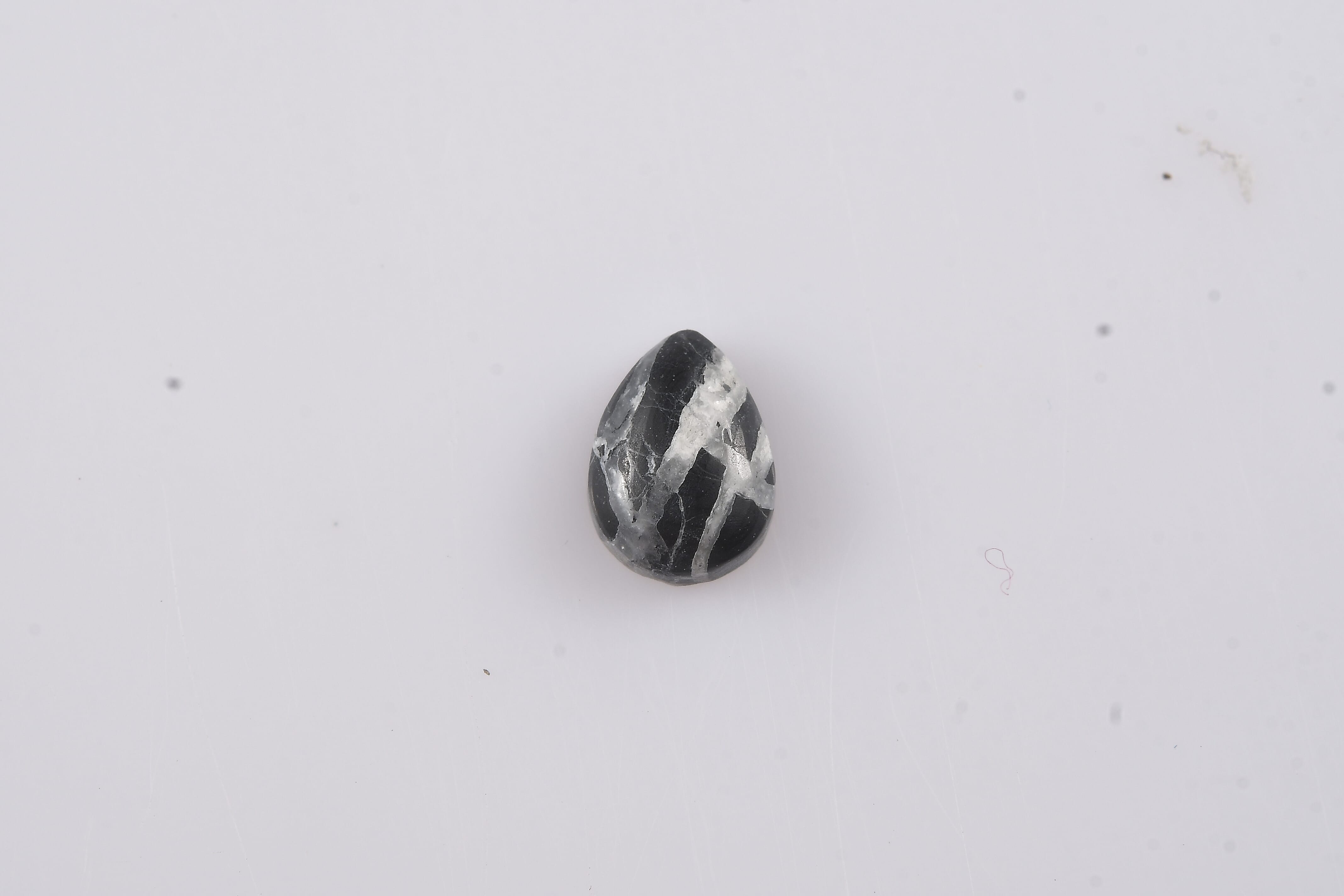 White Buffalo (Pear 7x5 mm) 0.65 ctw Loose Gemstone
