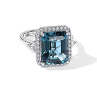 D''Joy London Blue Topaz and Moissanite 7.85 ctw Ring in Rhodium Over Sterling Silver (Size 10.0)