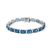 D''Joy London Blue Topaz and Moissanite 26.70 ctw Bracelet in Rhodium Over Sterling Silver (7.25 In)